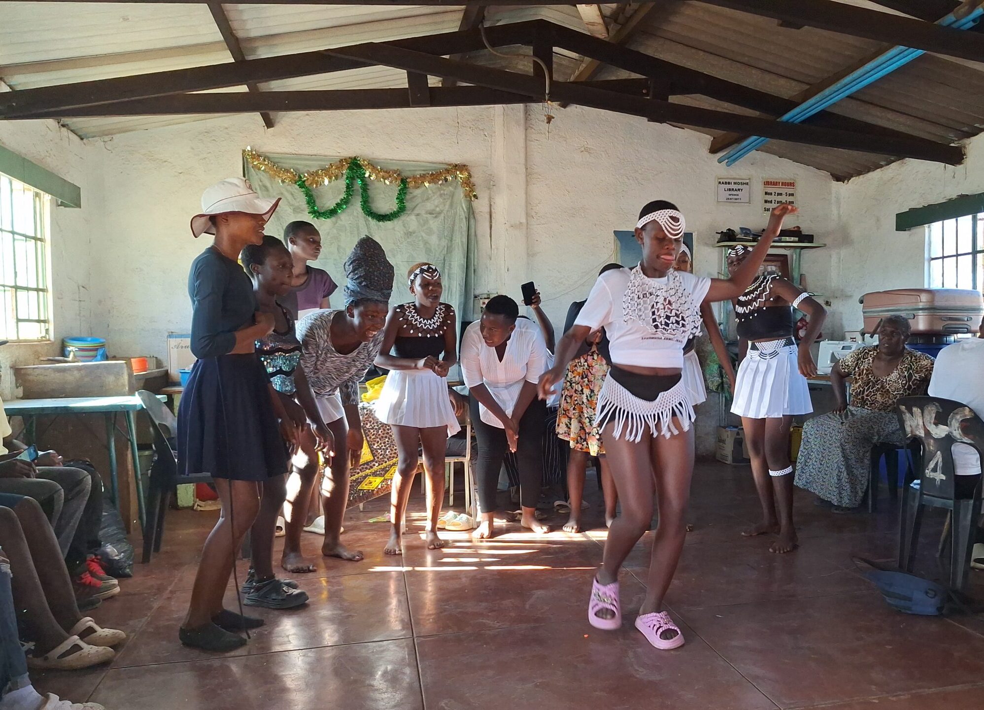 Young ladies dancing in traditional bead wear