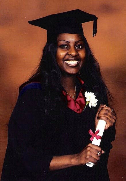 Female graduate smiles holding their certificate